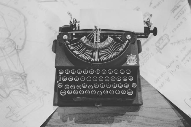 A black typewriter on a table