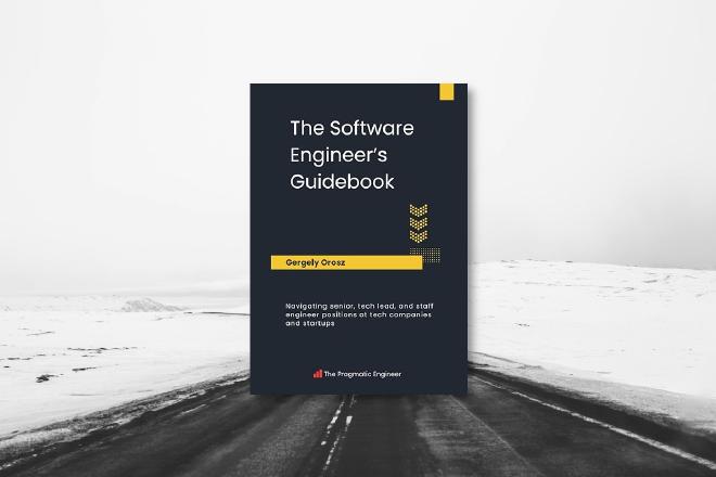 An asphalt road towards a snow field